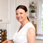 Tammy with a labeled bread bin in her own kitchen